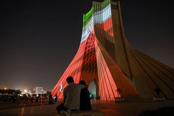 Tehran's iconic Azadi (Freedom) Square lit with the three colours of the Iranian flag, July 2025
