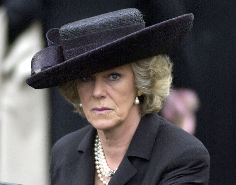 Queen Camilla wears a black outfit to attend the Queen Mother's funeral on April 9, 2002