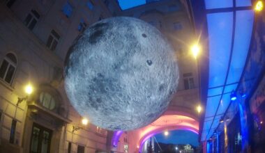 Budapest, Hungary - Inflatable mini-Moon suspended in a small street