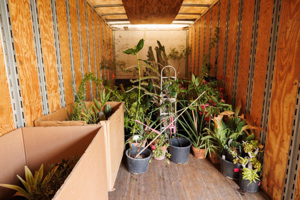 pants loaded into the back of a moving truck