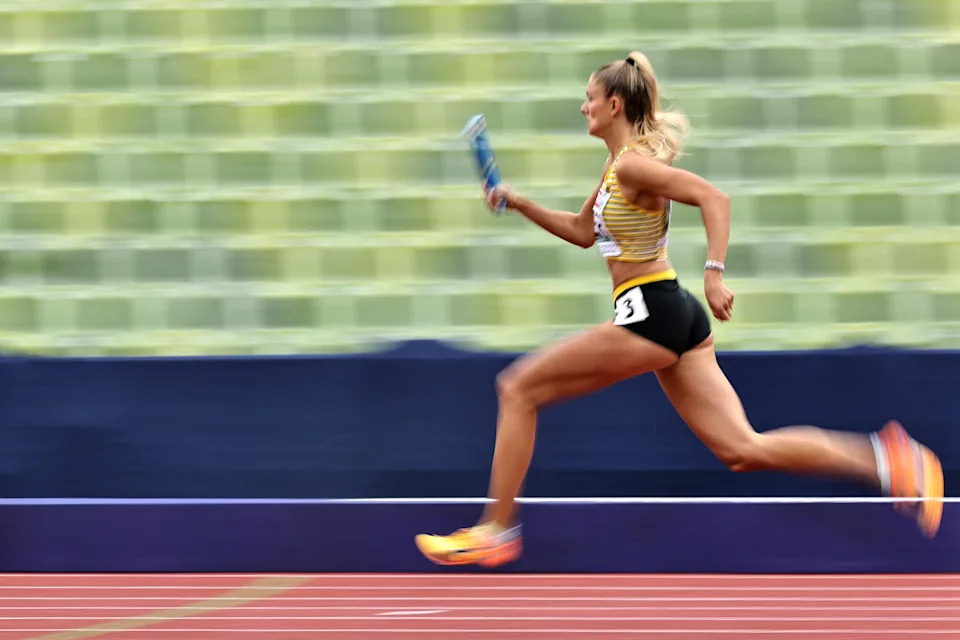 MUNICH, GERMANY - AUGUST 19: Alica Schmidt of Germany competes in the Women's 4 x 400m Relay Round 1 - Heat 2 during the Athletics competition on day 9 of the European Championships Munich 2022 at Olympiapark on August 19, 2022 in Munich, Germany. (Photo by Simon Hofmann/Getty Images for European Athletics)