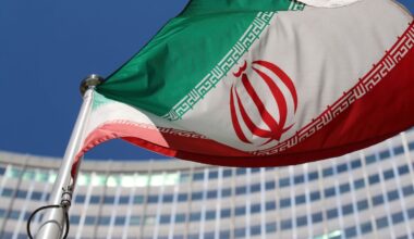The Iranian flag flies in front of a U.N. building in Vienna, Austria.