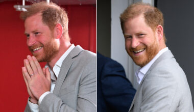 Prince Harry wears a gray suit jacket, a white shirt, and dark slacks and has red hair as he visits the UK in September 2025
