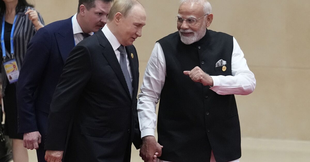 Moment Putin holds hands with Indian PM Modi at 'anti-NATO' summit | World | News