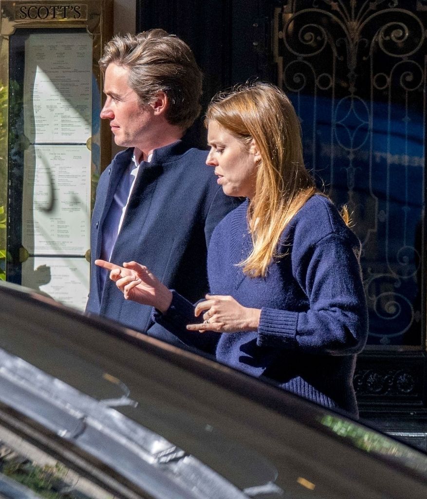 Princess Beatrice checks her phone outside Scotts with Edoardo Mapelli Mozzi
