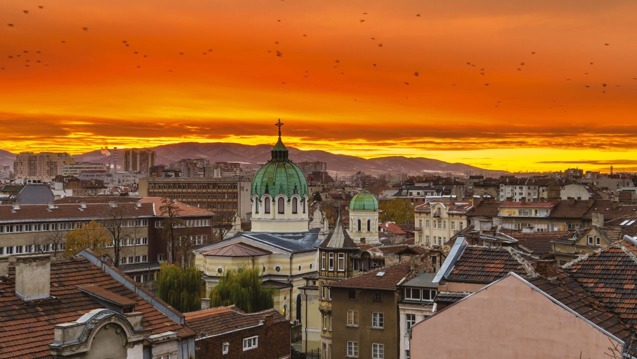 Sunset over Sofia’s St. Cyril and Methodius Temple with a backdrop of the Vitosha Mountain