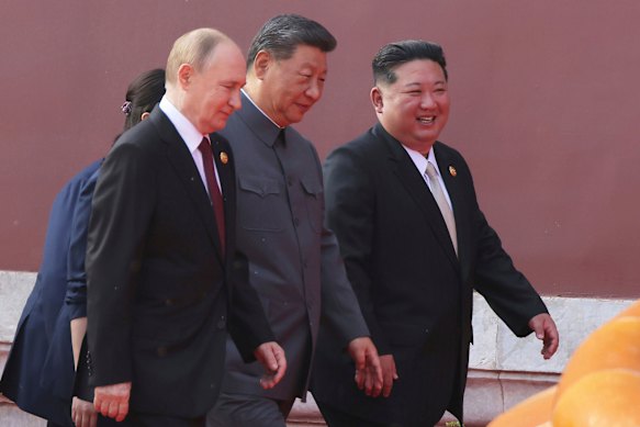 Russian President Vladimir Putin, Chinese President Xi Jinping and North Korean leader Kim Jong-un attend the military parade in Beijing on September 3.