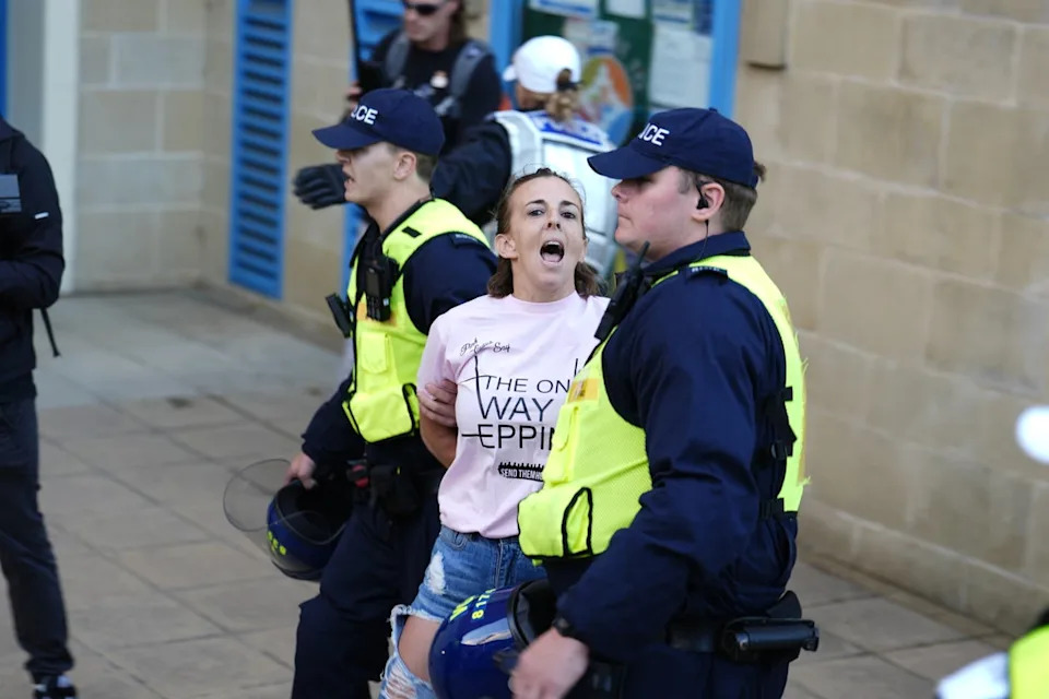 A protester is detained by police after hanging a Union flag from the civic offices (Jordan Pettitt/PA Wire)