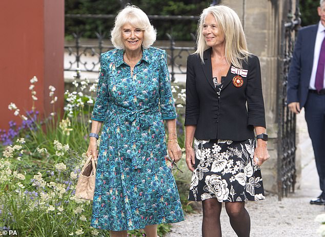 Queen Camilla in a Bombshell clothing print dress at the opening of an exhibition of New Covent Garden Market's British Flowers Week