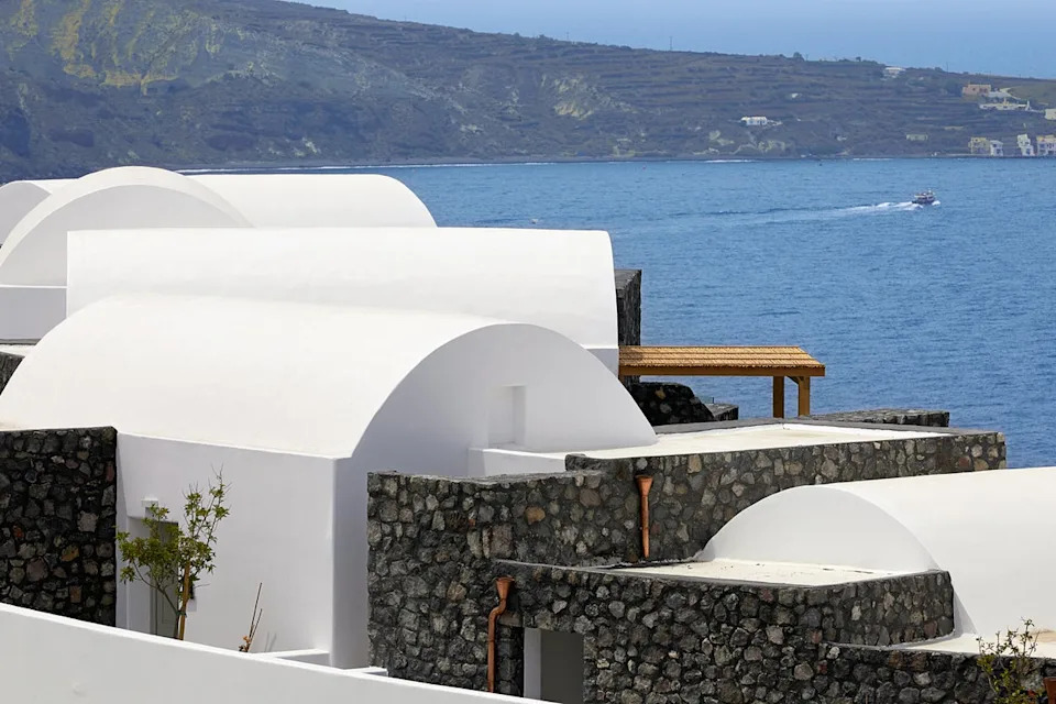 While the resort does not have a beach, suites still have a prime view over the sparkling Aegean (Santo Collection)