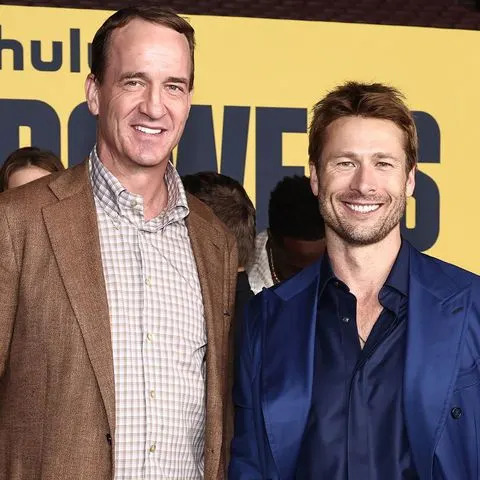 John Salangsang/Shutterstock Peyton Manning and Glen Powell