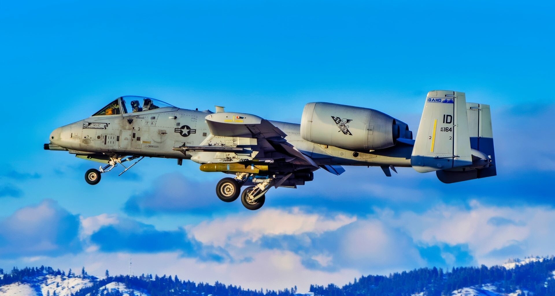 Idaho National Guard pilots land A-10 Thunderbolt IIs after a flight mission near Gowen Field on March 15, 2023 with the Boise foothills in the background. (U.S. National Guard photo by Master Sgt. Becky Vanshur)