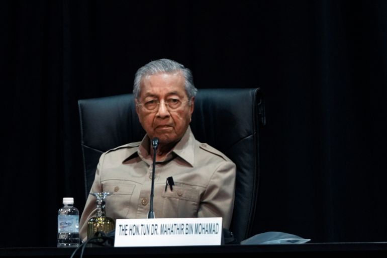 Malaysia's interim leader Mahathir Mohamad attends a committee on the exercise of the inalienable rights of the Palestinian people, in Kuala Lumpur, Malaysia, Friday, Feb. 28, 2020. The speaker of Malaysia's House rejected Mahathir Mohamad's call for a vote next week to choose a new premier, deepening the country's political turmoil after the ruling alliance collapsed this week. (AP Photo/Vincent Thian)