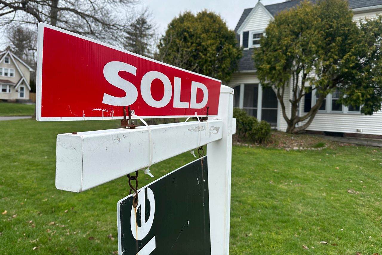A sold sign hangs in front of a Brighton, N.Y. house on Wednesday, April 16, 2025.