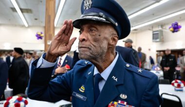 Brigadier General Enoch “Woody” Woodhouse II, a Tuskegee Airman and Roxbury native, saluted during the national anthem at the Black Veterans Appreciation Brunch in Boston in 2024.