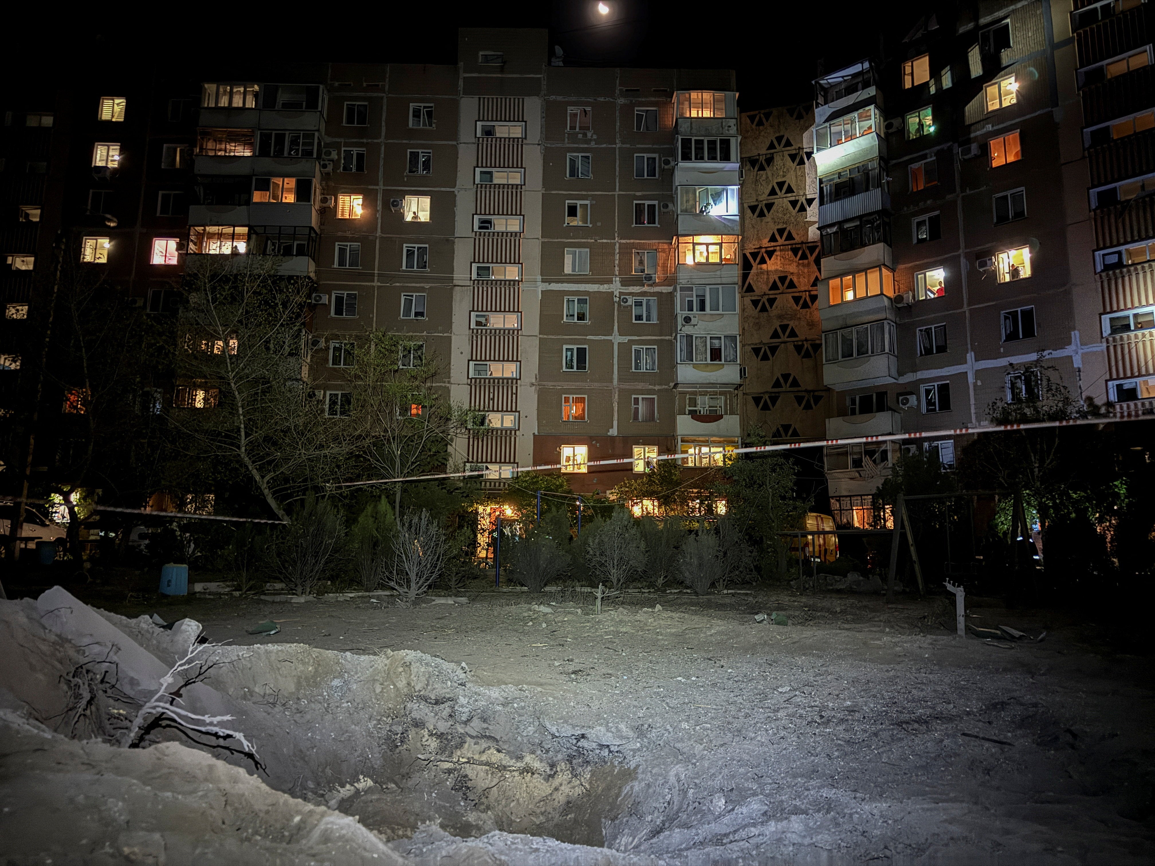 A view shows a crater near the apartment building damaged during a Russian missile strike in Zaporizhzhia
