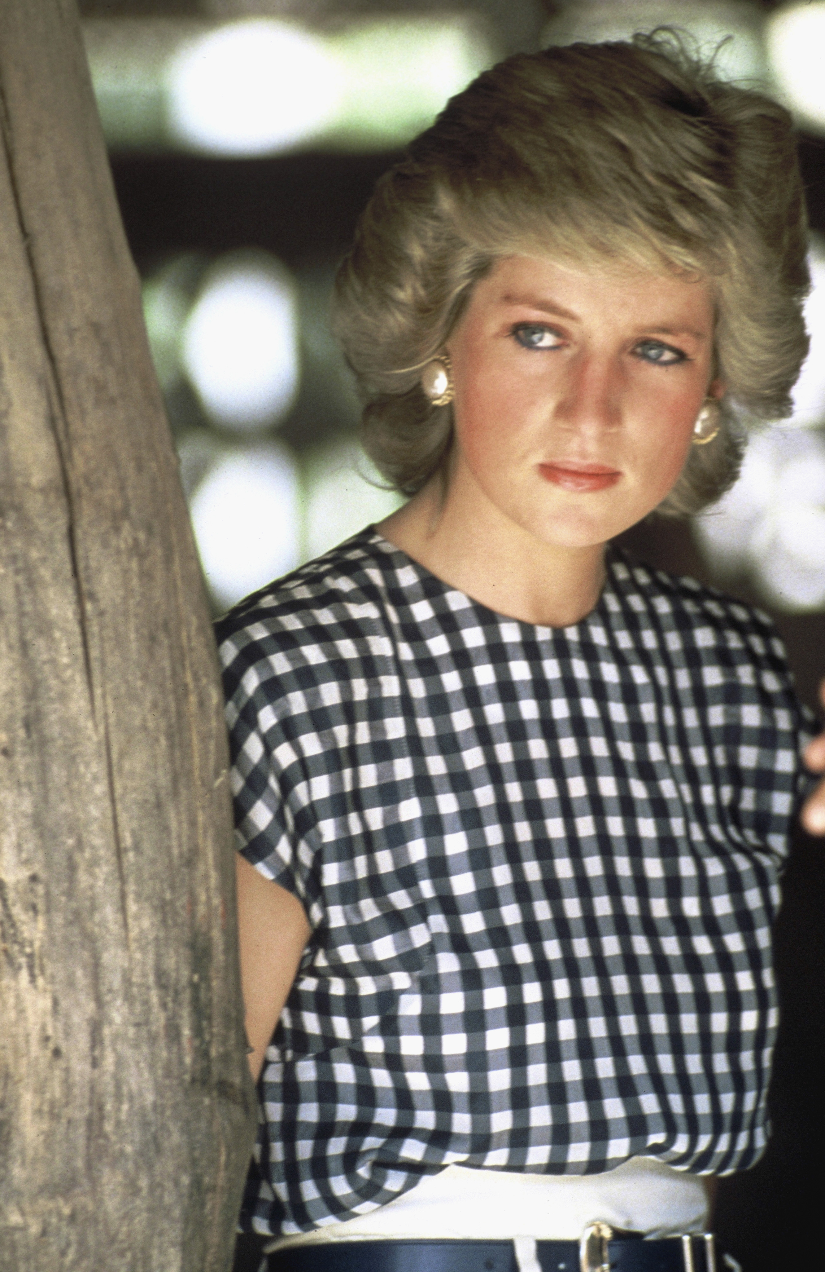 Princess Diana wears a gingham top and white pants in Chiang Mai, Thailand on February 5, 1988