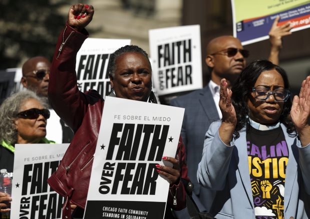 Rev. Ebony Only, left, and Pastor Leslie Glover cheer during an interfaith LIVE FREE Illinois rally in Daley Plaza on Sept. 8, 2025. (Eileen T. Meslar/Chicago Tribune)