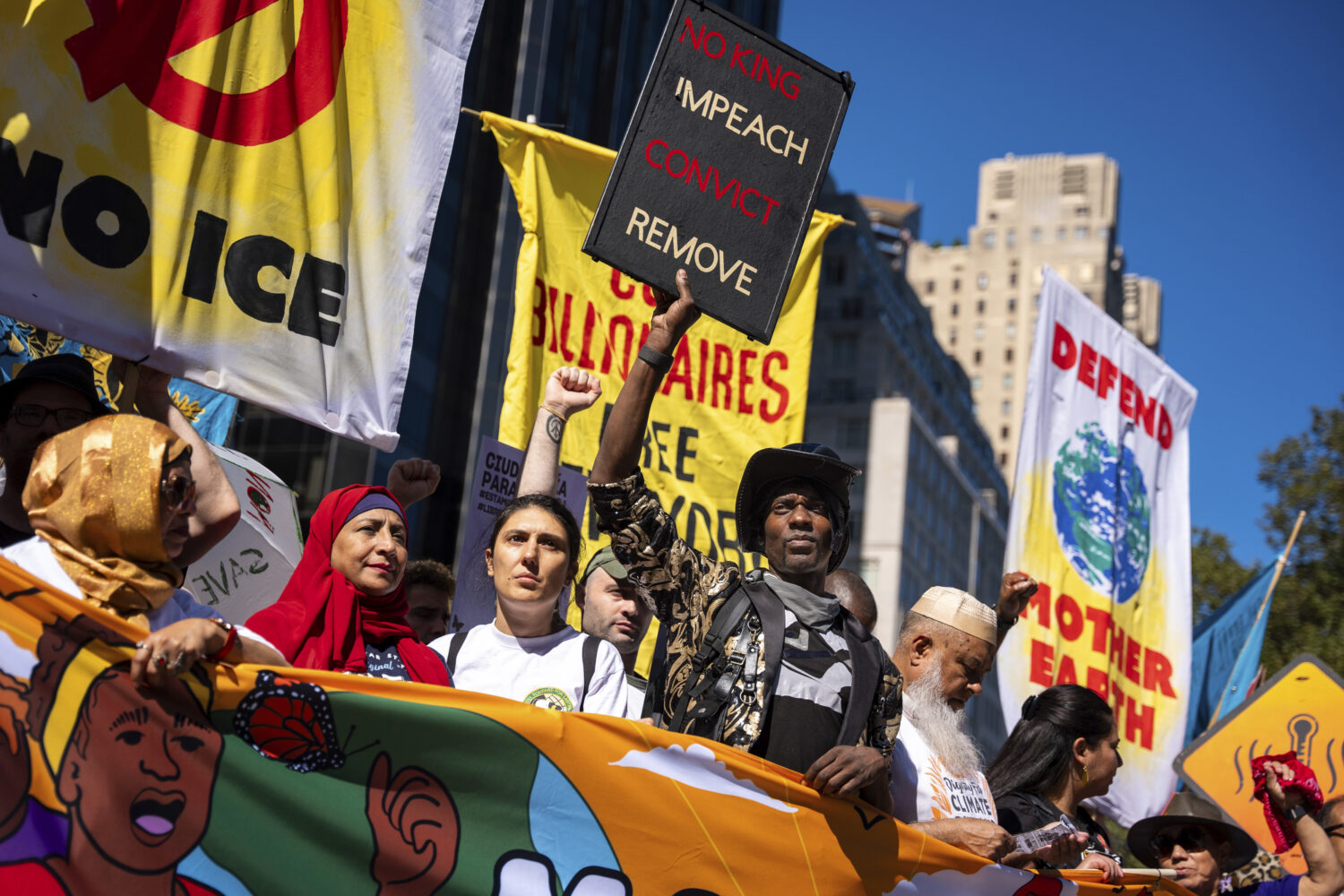 Protestors march through Manhattan up to Central Park at the "Make Billionaires Pay" climate protes...