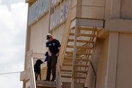 An officer from ATF, the Bureau of Alcohol, Tobacco, Firearms and Explosives, and a dog...