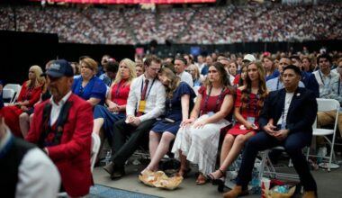 Mourners listen as Erika Kirk speaks at a memorial for her late husband conservative activist Charlie Kirk on Sunday, Sept. 21 at State Farm Stadium in Glendale, Ariz.