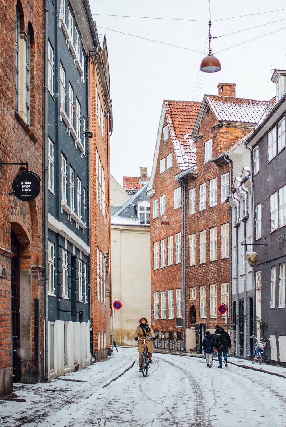 Image may contain Fakhra Younus City Urban Clothing Glove Bicycle Transportation Vehicle Person Road and Street