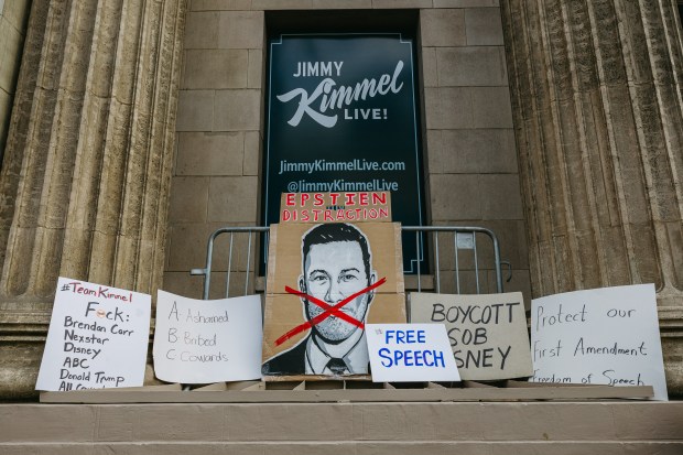 Protest signs are displayed outside the El Capitan Theatre, home of "Jimmy Kimmel Live!," on Hollywood Boulevard in Hollywood, Calif., Thursday, Sept. 18, 2025. Messages included "Epstien Distraction," "Boycott Disney," and "Protect our First Amendment," as demonstrators rallied a day after the show's suspension. (Photo by David Pashaee / Middle East Images via AFP) (Photo by DAVID PASHAEE/Middle East Images/AFP via Getty Images)