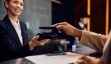 A person is paying with a credit card at a reception.