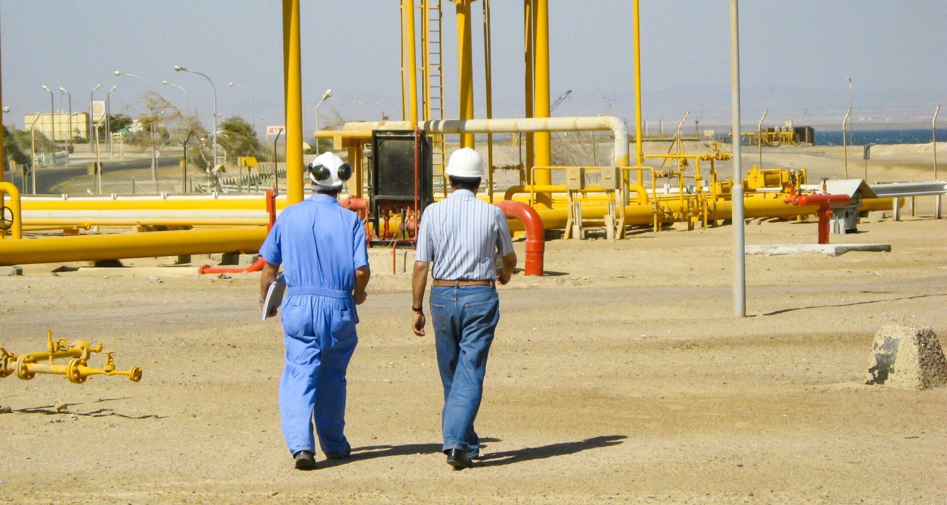 Two engineers inspect an installation at an oil and gas facility in Egypt