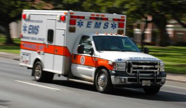 A speeding emergency medical services ambulance, with motion blur