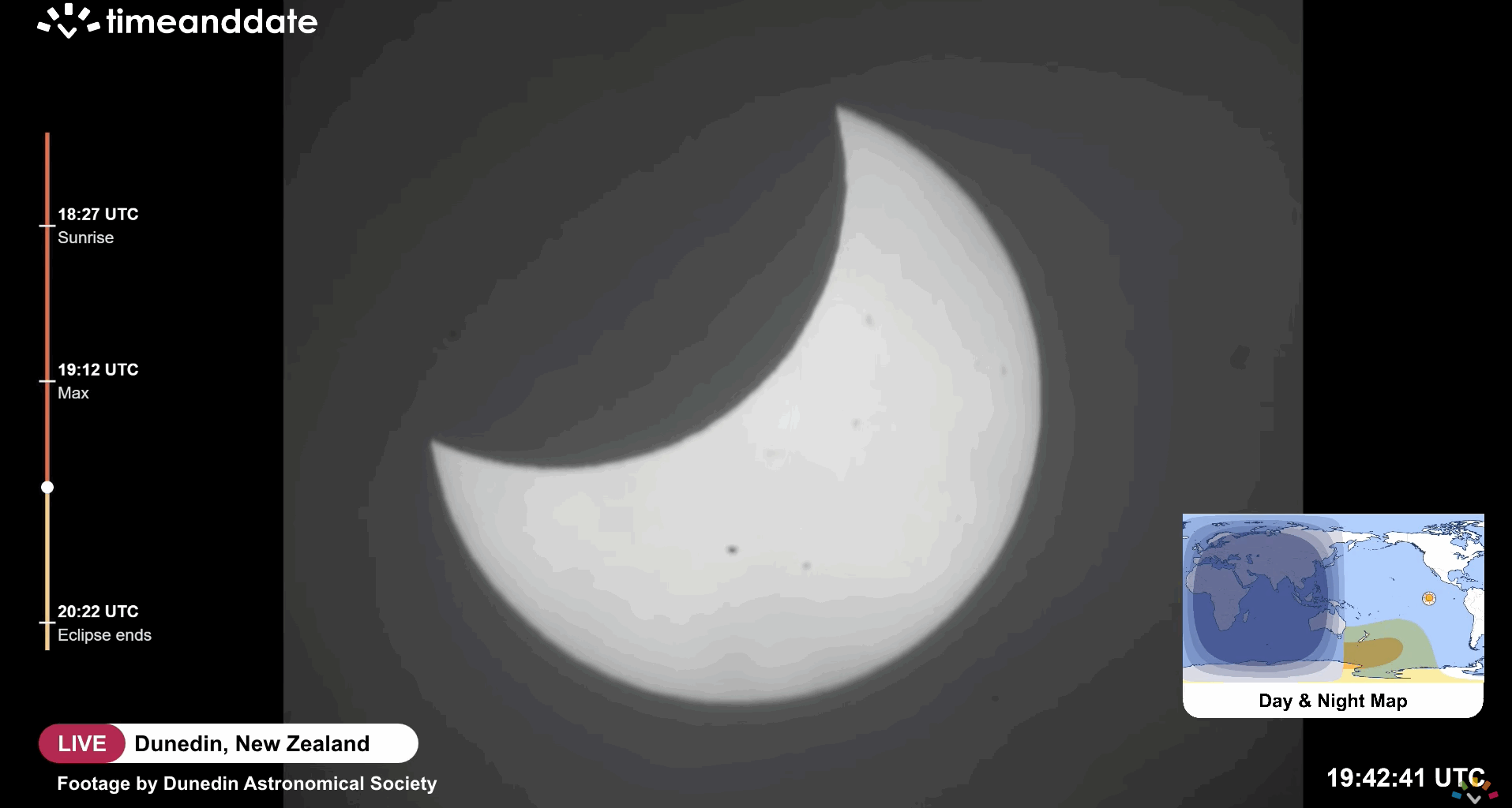 A picture of the sun's disk with its left side blocked by the curved outline of the moon's silhouette.