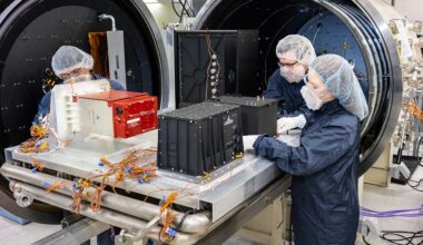 From left, engineering technologist Adolfo Salazar, systems engineer Sean Walker and systems engineer Lauren Ratliff prepare sensors from the next generation of detectors to undergo thermal vacuum testing at Sandia. (Photo by Bret Latter) Click on the thumbnail for a high-resolution image.