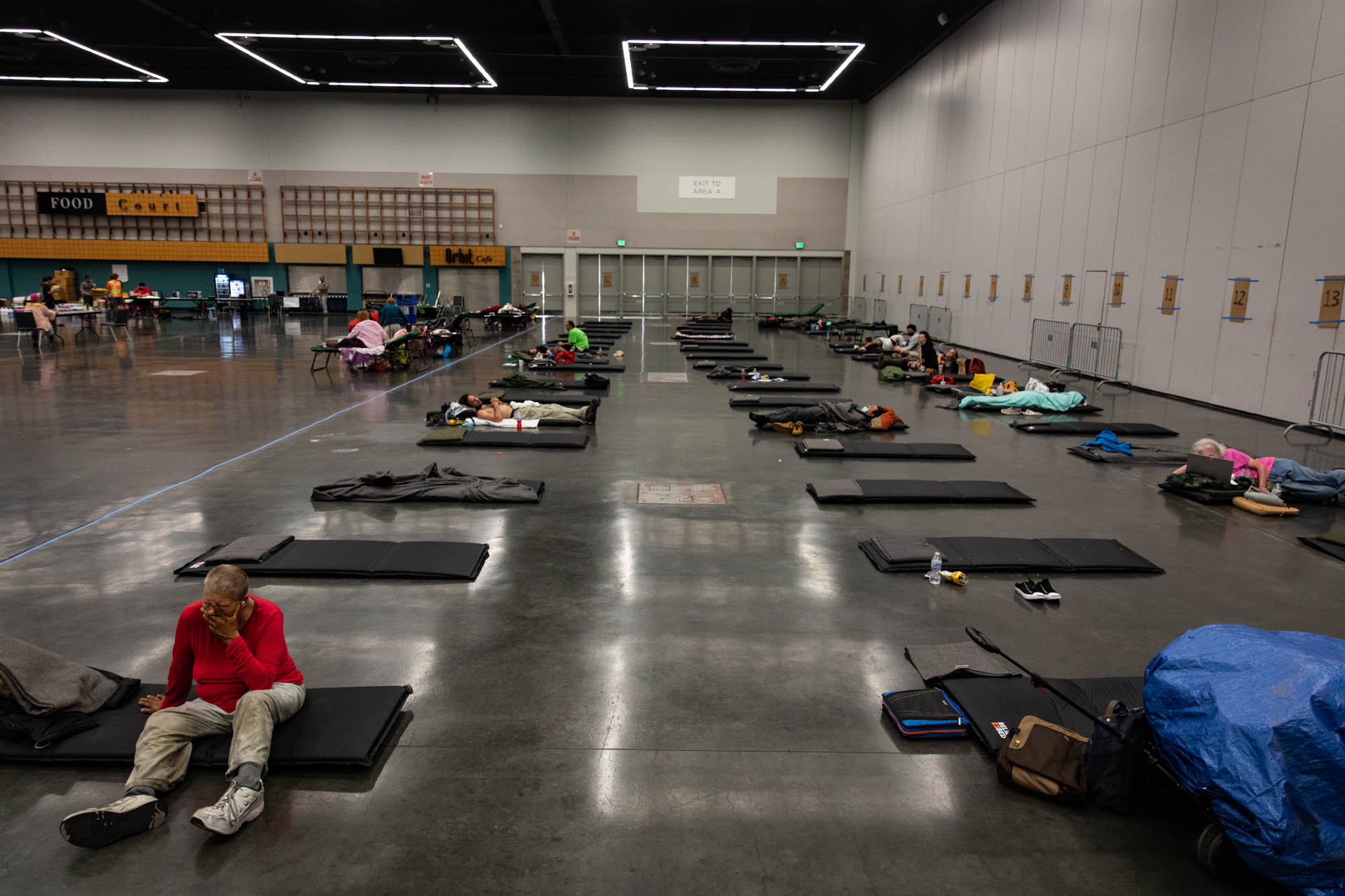 Residents gather in a public cooling shelter set up at the Oregon Convention Center during a heat wave in Portland, Ore., on June 26, 2021. Credit: Maranie Staab/Bloomberg via Getty Images