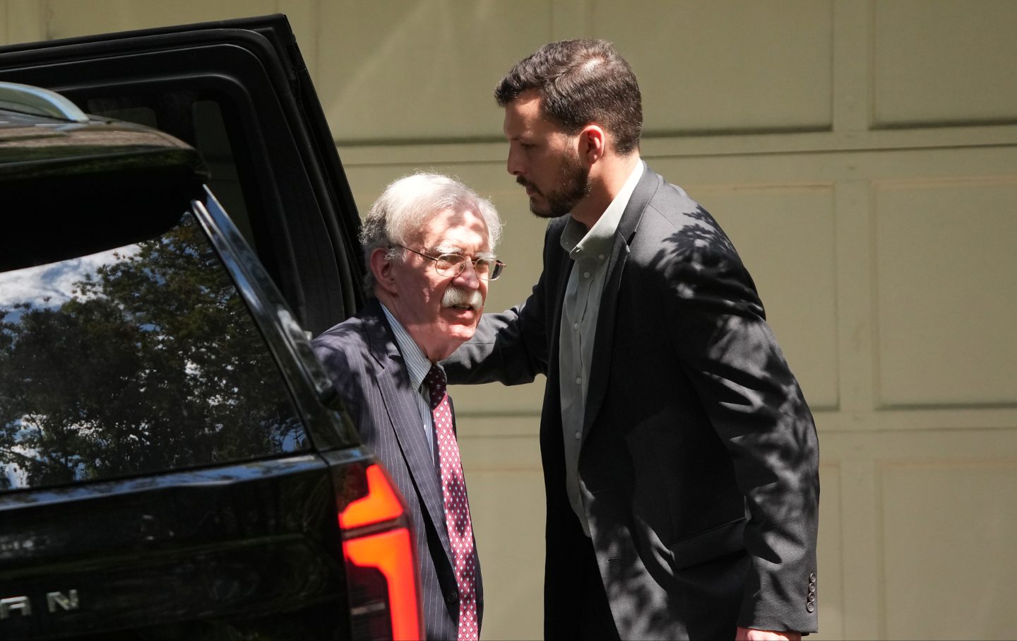 John Bolton, former national security adviser to President Trump, arrives home, as the FBI searches his house August 22, 2025 in Bethesda, Maryland.