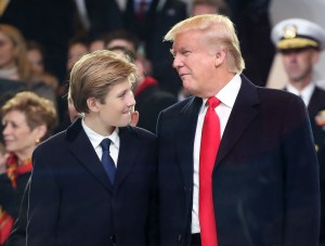 WASHINGTON, DC - JANUARY 20:  U.S. President Donald Trump stands with his son Barron Trump inside of the inaugural parade reviewing stand in front of the White House on January 20, 2017 in Washington, DC. Donald Trump was sworn in as the nation's 45th president today.  (Photo by Mark Wilson/Getty Images)