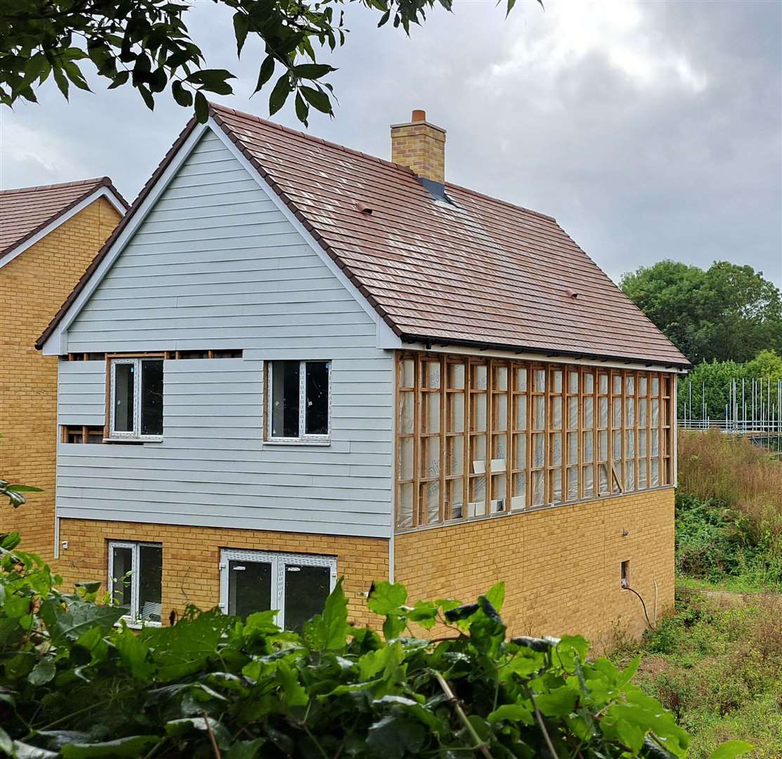 An unfinished flank wall on one of the properties