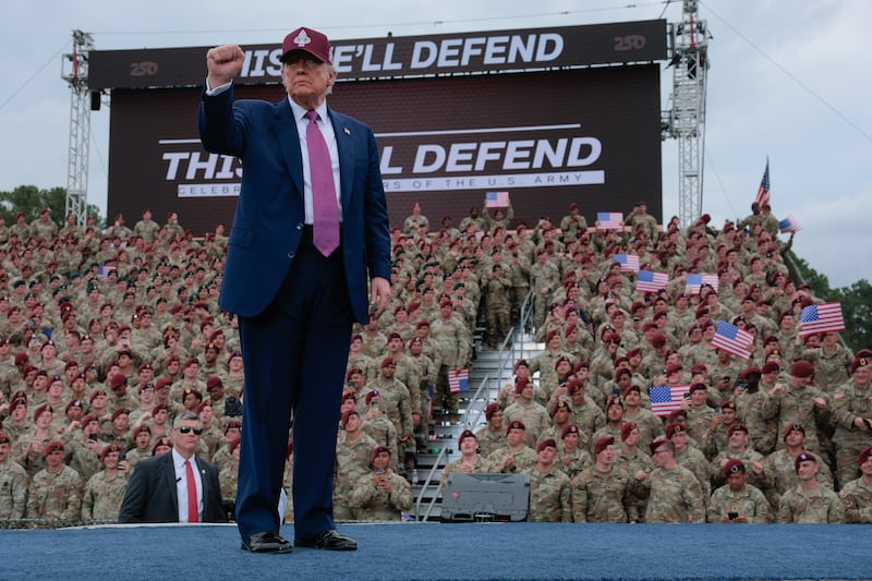 President Donald Trump pumps his fist as he leaves the stage during a rally with U.S. Army troops on June 10, 2025 at Fort Bragg, North Carolina.