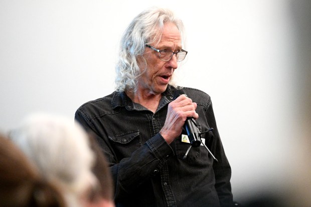 Ryan Ulyate speaks during the public comment portion of a...