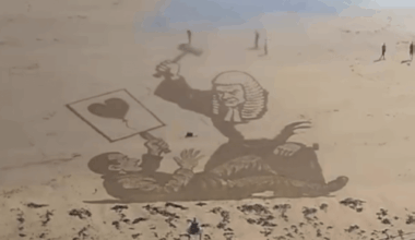Recently removed Banksy peice redrawn on a beach in Scarborough