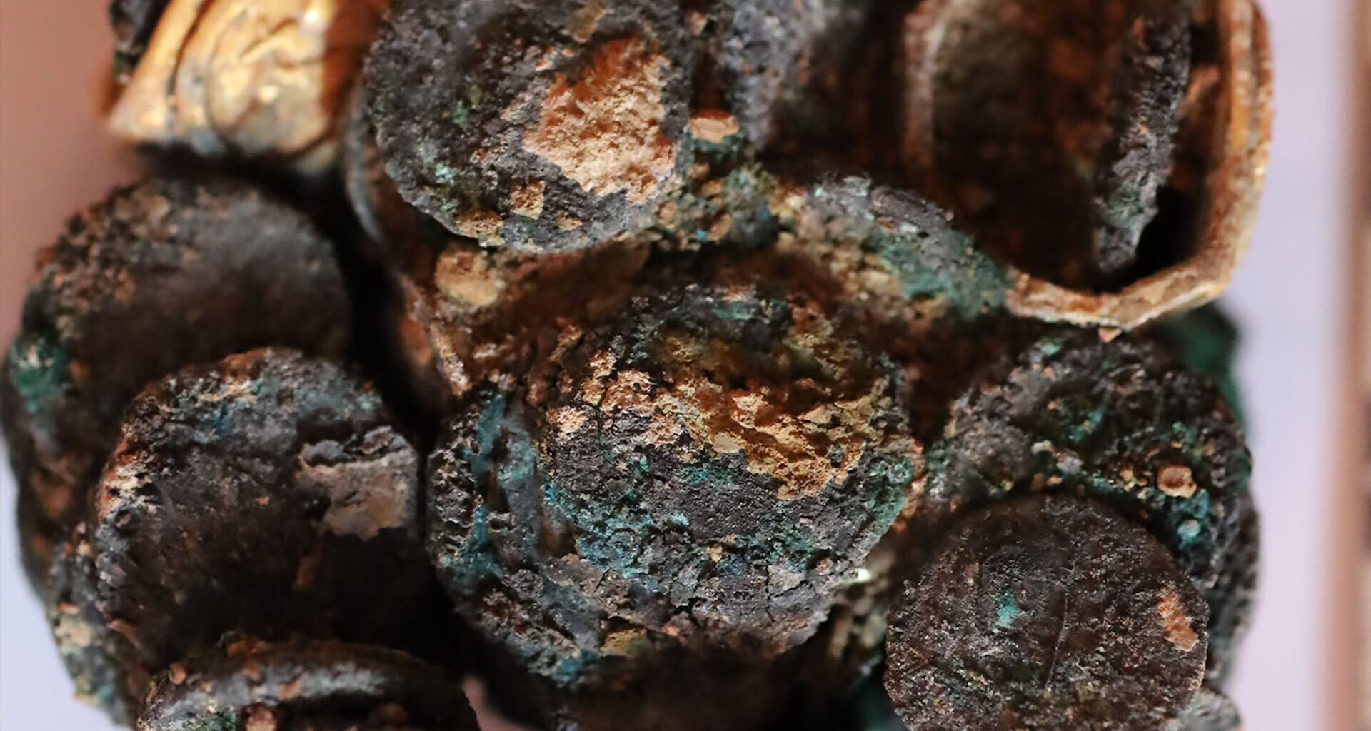 a clump of burnt and charred coins