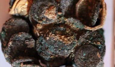 a clump of burnt and charred coins
