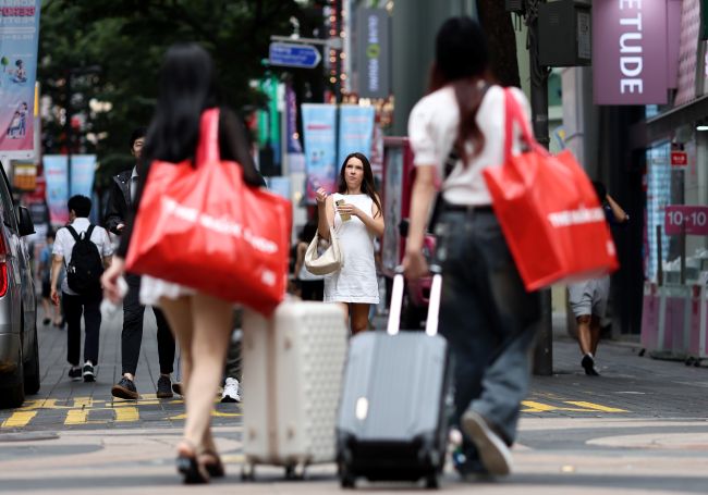 This file photo shows a street in the popular tourist district of Myeongdong, in central Seoul, on June 26, 2025. (Image courtesy of Yonhap)