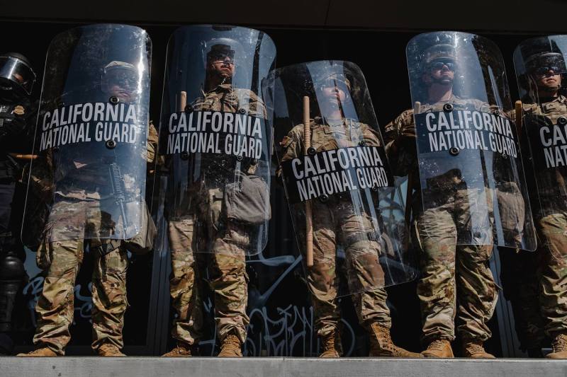 National Guardsmen stand outside of the Edward Roybal Federal Building in Los Angeles, California, on June 9.