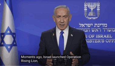 Israeli official giving a televised statement at a podium with the Israeli flag and government insignia in the background; caption mentions Operation Rising Lion.