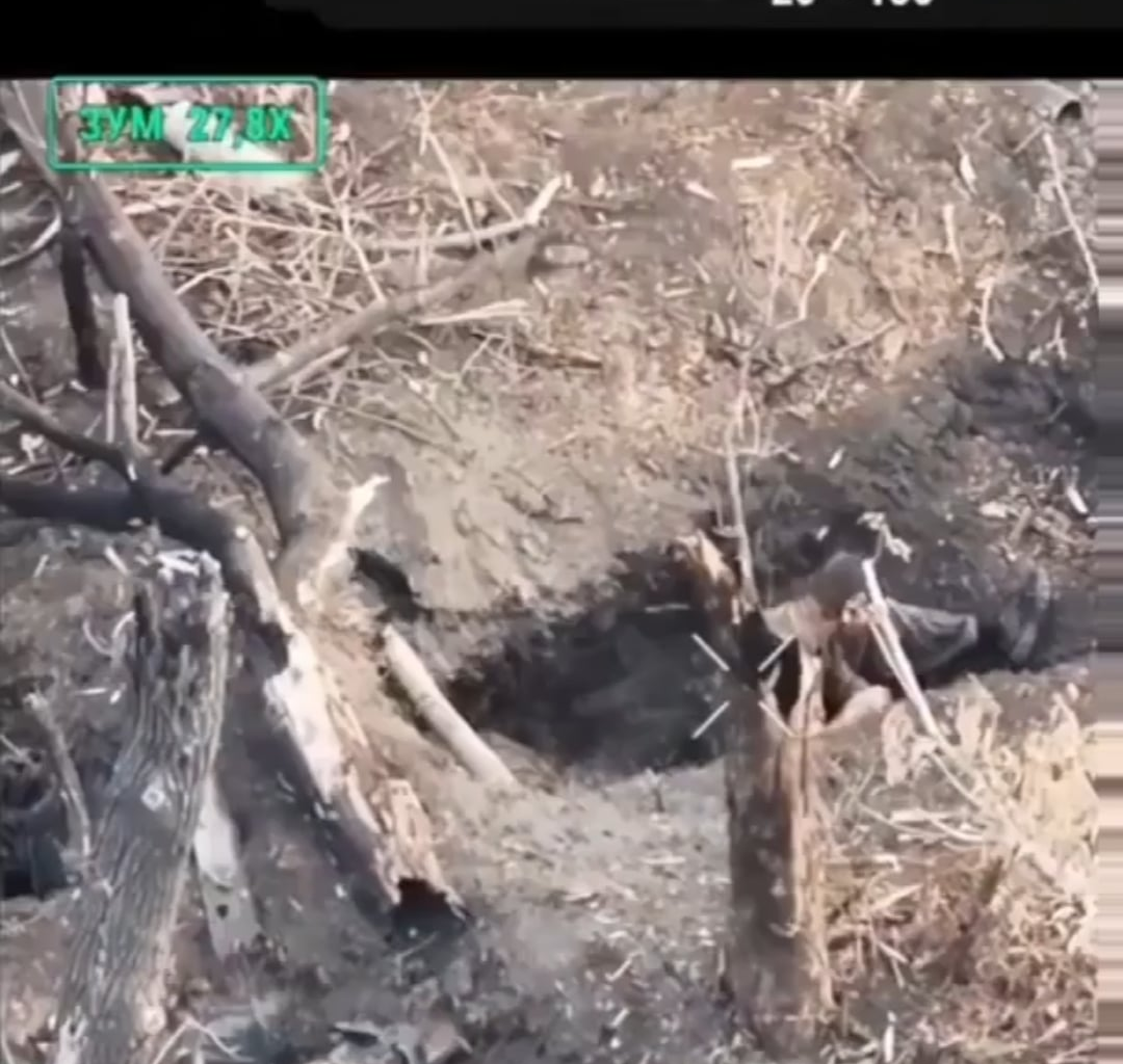 russian soldier resting in a shallow foxhole is hit by a Ukrainian FPV drone.