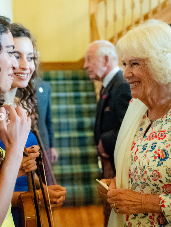 Queen Camilla talks to performers after the recording of a special radio programme at Balmoral