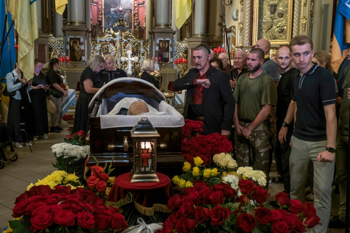 Hundreds mourn pro-Western Ukrainian politician who was gunned down in the street