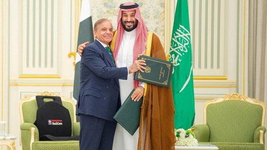 Saudi Crown Prince Mohammed bin Salman and Pakistan Prime Minister Shehbaz Sharif embrace each other on the day they sign a defence agreement, in Riyadh, Saudi Arabia, September 17, 2025.(via REUTERS)
