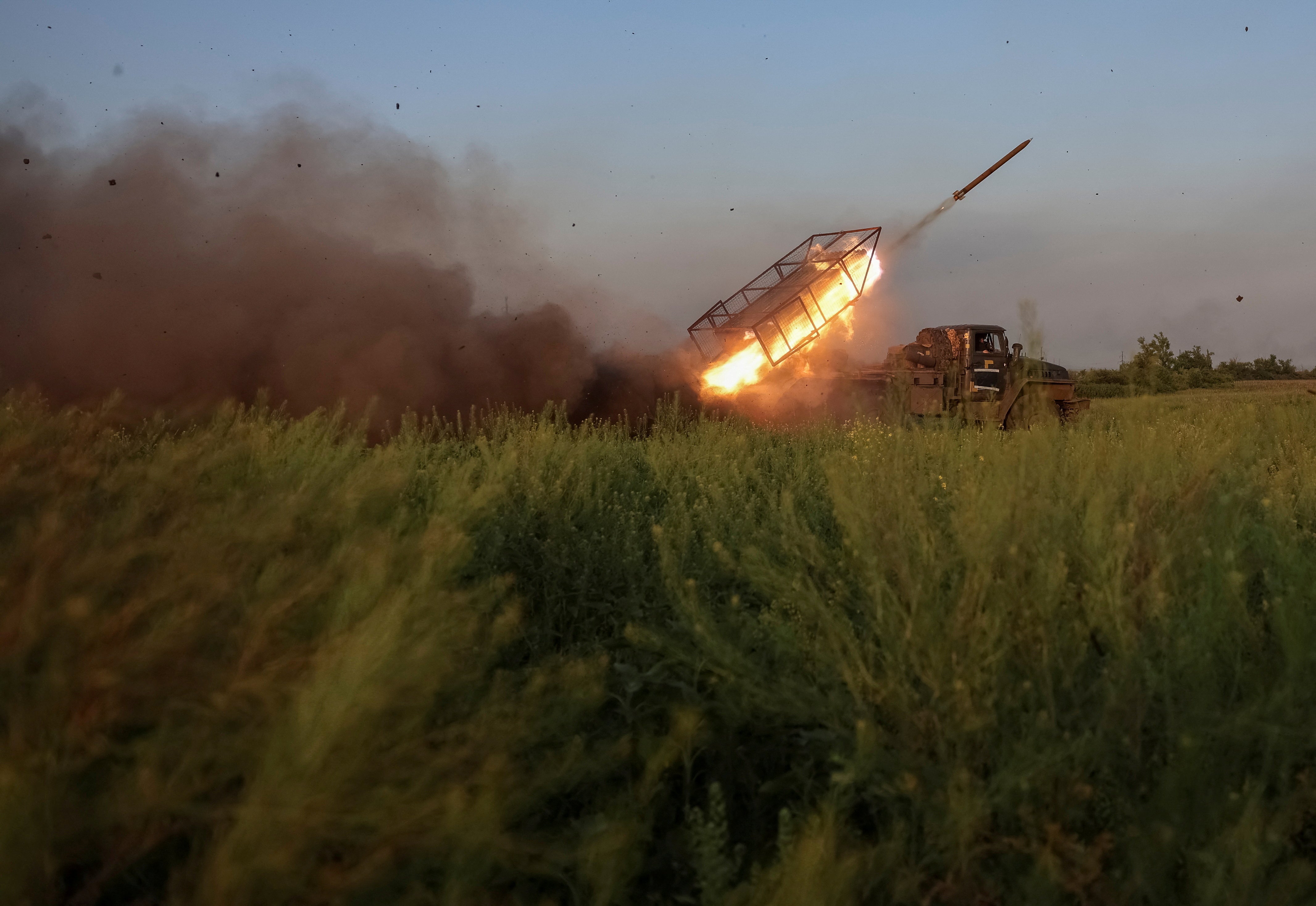 Servicemen of the 25th Separate Airborne Brigade of the Armed Forces of Ukraine fire a BM-21 Grad multiple rocket launch system towards Russian troops near the frontline town of Pokrovsk