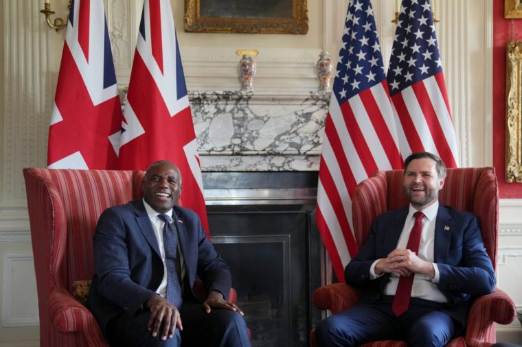 U.S. Vice President JD Vance and British Foreign Secretary David Lammy laugh during a meeting at Chevening House in Sevenoaks, Kent, Britain August 8, 2025. Kin Cheung/Pool via REUTERS